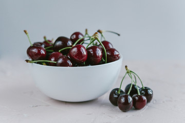 Fresh sweet cherry in a white plate. fresh ripe cherries. cherries.