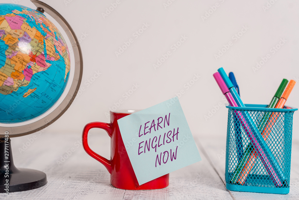 Poster writing note showing learn english now. business concept for gain or acquire knowledge and skill of 
