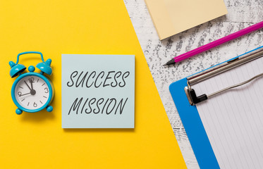 Word writing text Success Mission. Business photo showcasing getting job done in perfect way with no mistakes Task made Notepads clipboard colored paper sheet marker alarm clock wooden background