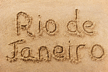 Rio de Janeiro word written in sand sign writing drawing drawn on a sunny brazil summer beach holiday vacation travel destination message photo
