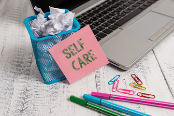 Writing note showing Self Care. Business concept for the practice of taking action to improve one s...