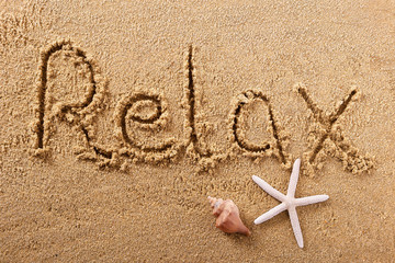 Relax handwritten beach sand message