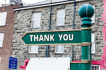 Writing note showing Thank You. Business concept for a polite expression used when acknowledging a...