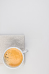 light grey mug with coffe work feminine top view fltalay workspace minimalistic