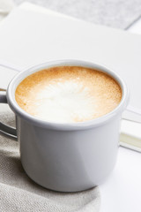 light grey mug with coffe light grey work feminine workspace minimalistic