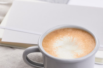 light grey notebook mug with coffe light grey work feminine workspace minimalistic