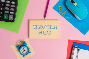 Conceptual hand writing showing Disruption Ahead. Concept meaning Transformation that is caused by emerging technology Mouse calculator sheets marker clipboard clock color background