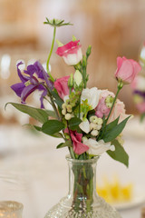 mixed wedding bouquet of pink flowers in vase