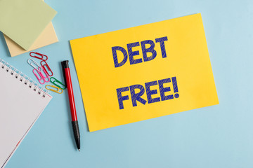 Writing note showing Debt Free. Business concept for does not owning any money to any individual or...