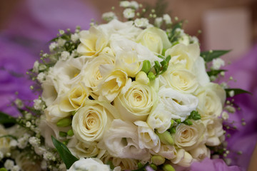 white and yellow wedding bouquet of flowers