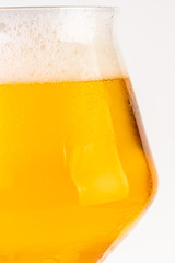 Glass of beer on white background