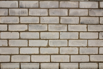Part of a white brick wall