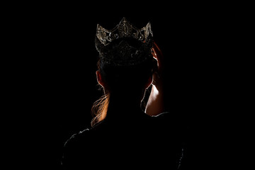 Portrait Silhouette Shadow Back Rim Light of Miss Pageant Beauty Queen Contest Silver Diamond Crown wave hand express feeling smile, studio lighting dark black background, turn front face to camera © Jade