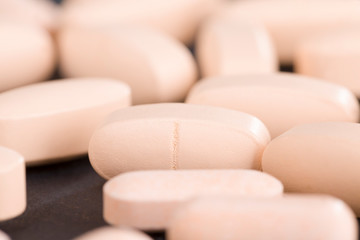 convex light-colored pills