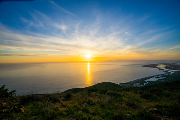 Aerial view of sunset over the ocean and beach from Point Magu, California