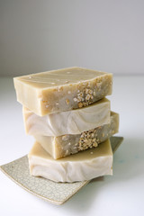 Natural oatmeal soap is placed on a white background.