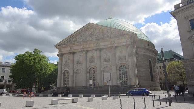 St  Hedwig's Cathedral with green dome. Tourists and citizens on public square, Bebelplatz, Berlin, Germany. 