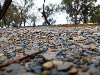 Low angle view of gravel stone road.