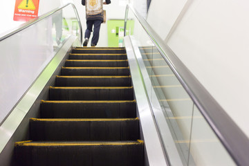 People on the escalator in shopping center