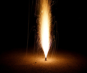 fountain fireworks stream into dark night