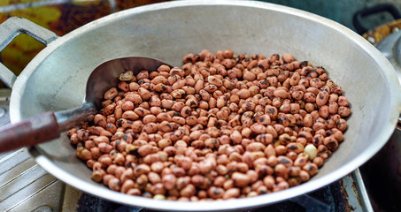 Roasted peanuts in a pan on the stove