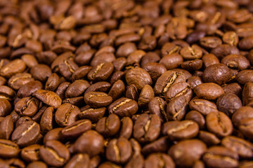 Background of many roasted coffee beans. Selective focus