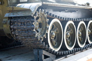 A tank of the second world war. Caterpillar armored closeup shot. Black track link and large...