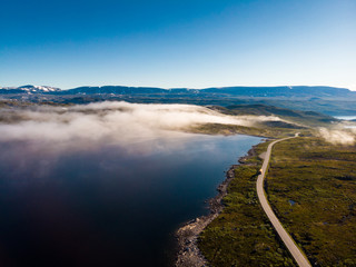 Road crossing Hardangervidda plateau, Norway. Aerial view.