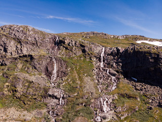 Waterfall in mountains. Norwegian route Sognefjellet