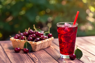 cherry juice or cocktail with ice in glass