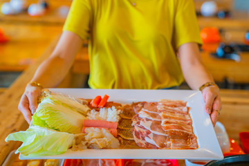 Shabu Shabu, a popular dish of pork, beef, shrimp, squid, seafood and fresh vegetables. Placed on a table with big set shabu shabu
