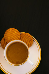 cup of coffee with biscuits on white background