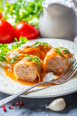 Cabbage rolls stuffed with ground beef and rice.
