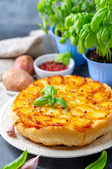 Traditional Tarte Tatin with potatoes and garlic.