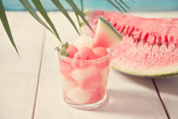 Fruit salad with melon and watermelon balls in glass