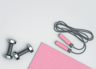 Pink fitness mat, dumbbells and jumping rope on the floor
