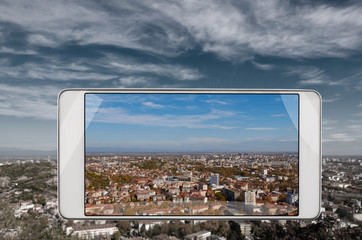 Smartphone displaying photo of bulgarian city Plovdiv, smart device concept