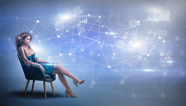 Elegant woman sitting in a sofa with network and connection concept