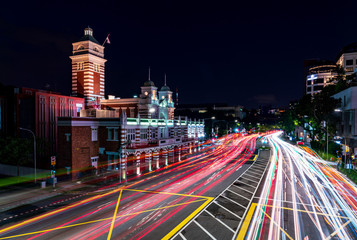 Fototapeta na wymiar Car light trails and Central Fire Station at Night, Singapore