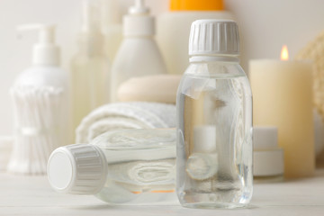 Personal hygiene products. Body care cosmetics. White bottles and vials on a light background. SPA. Relax.