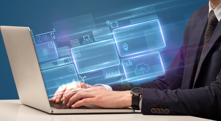 Hand typing on laptop with online accounting system concept