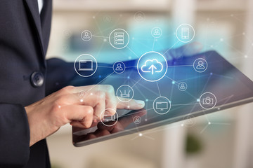 Business woman using tablet with network security and online storage system concept