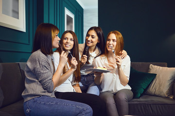 Young women chatting at a friends meeting at home