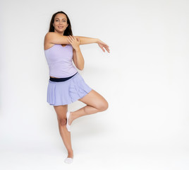 Full-length portrait on white background of beautiful pretty fitness girl woman in trendy tennis sport uniform, with different emotions in different poses, shows hands. Smiles. Stylish trendy youth.