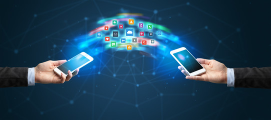 Two mobile phones syncing applications concept