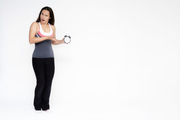 Full-length portrait on white background of beautiful pretty fitness girl woman in sports uniform with a clock in her hands, stands with different emotions in different poses. Stylish trendy youth.