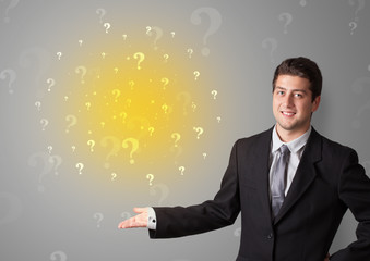 Young person presenting something with question sign concept