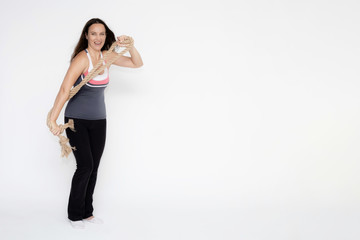Full-length portrait on white background of beautiful pretty fitness girl woman in sport uniform with rope in hands, with different emotions in different poses. Stylish trendy youth.