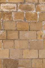 The texture of the old wall of large bricks