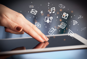 Hand holding tablet with drawn multimedia and application icons